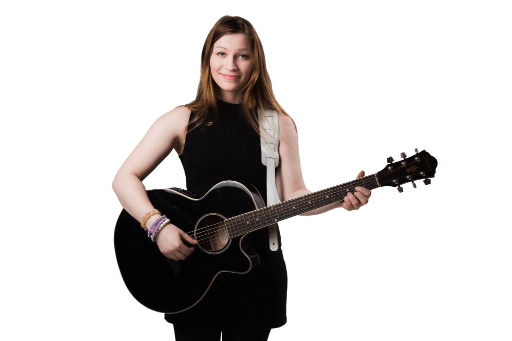 Aiki standing with guitar